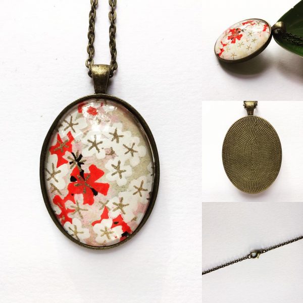 Pendant on a 24 inch chain. Japanese Chiyogami paper encased...